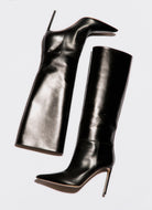 high heeled boot in black leather