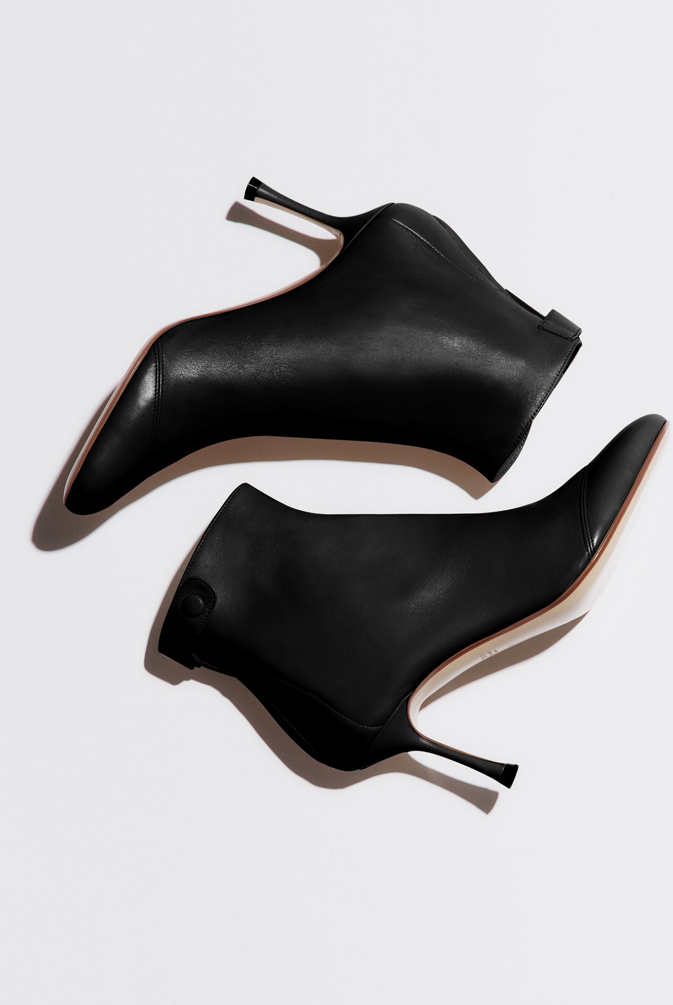 black soft bootie with a zip and button closure on the back heel hight 95mm