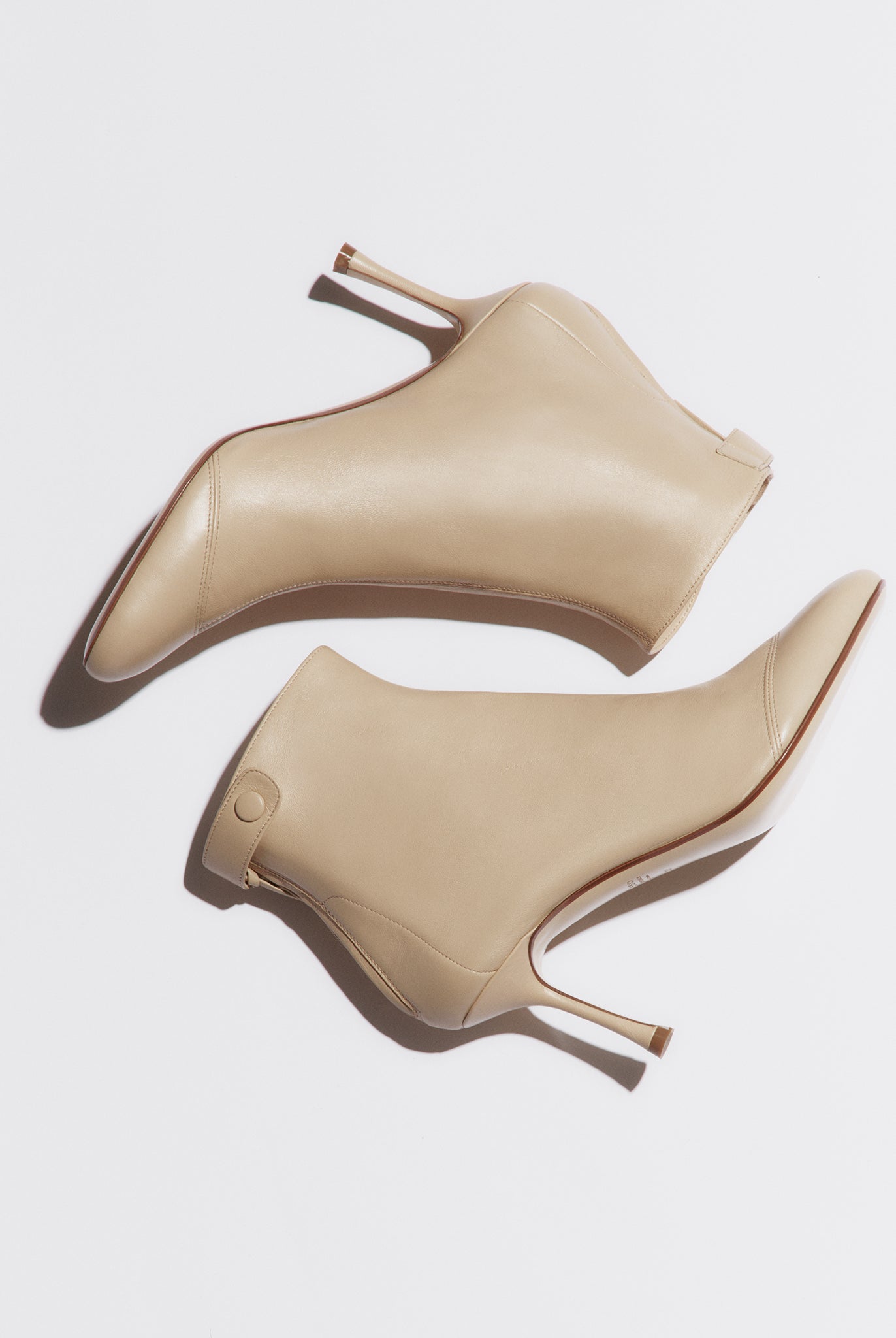 dust soft bootie with a zip and button closure on the back heel hight 95mm