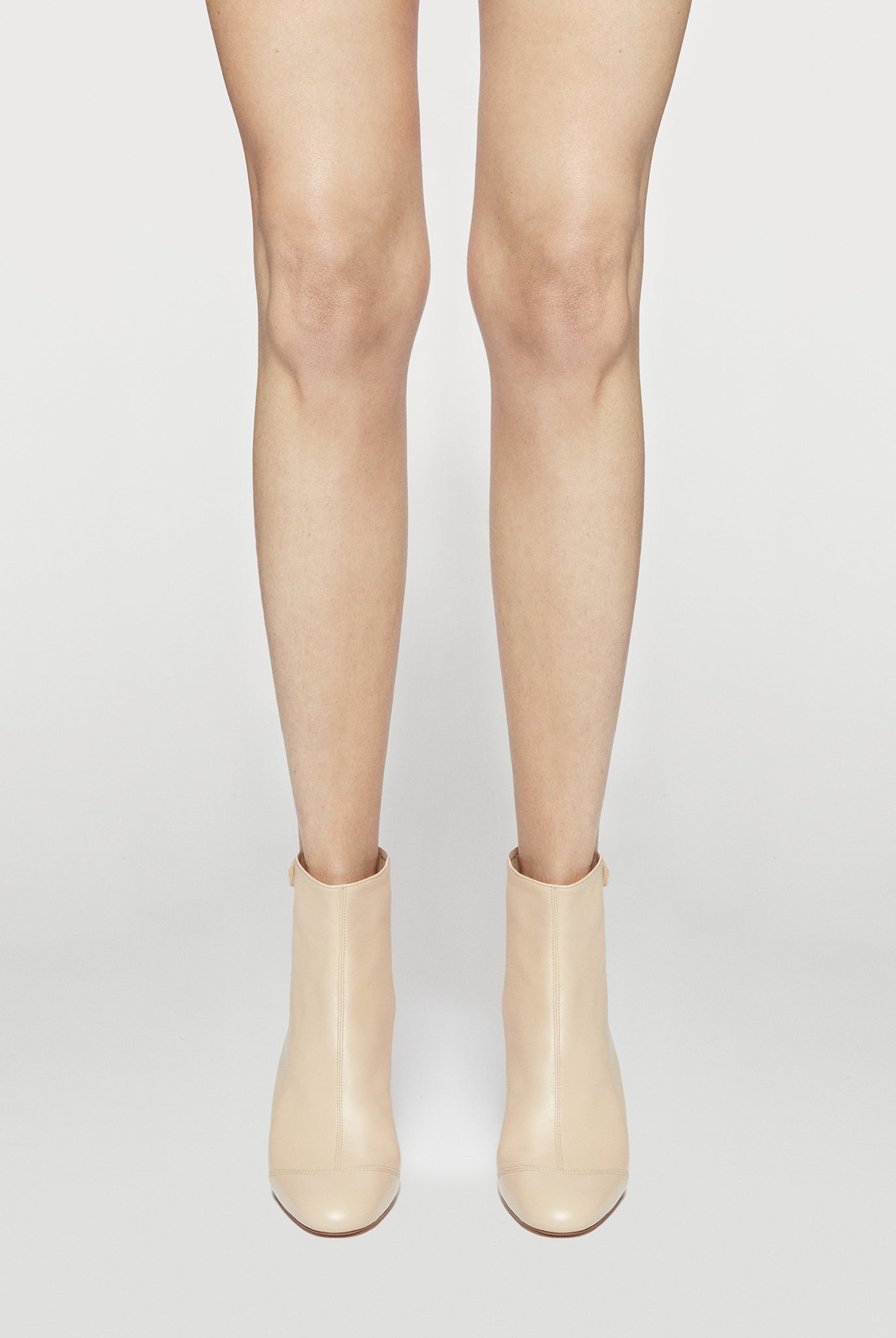 dust soft bootie with a zip and button closure on the back heel hight 95mm