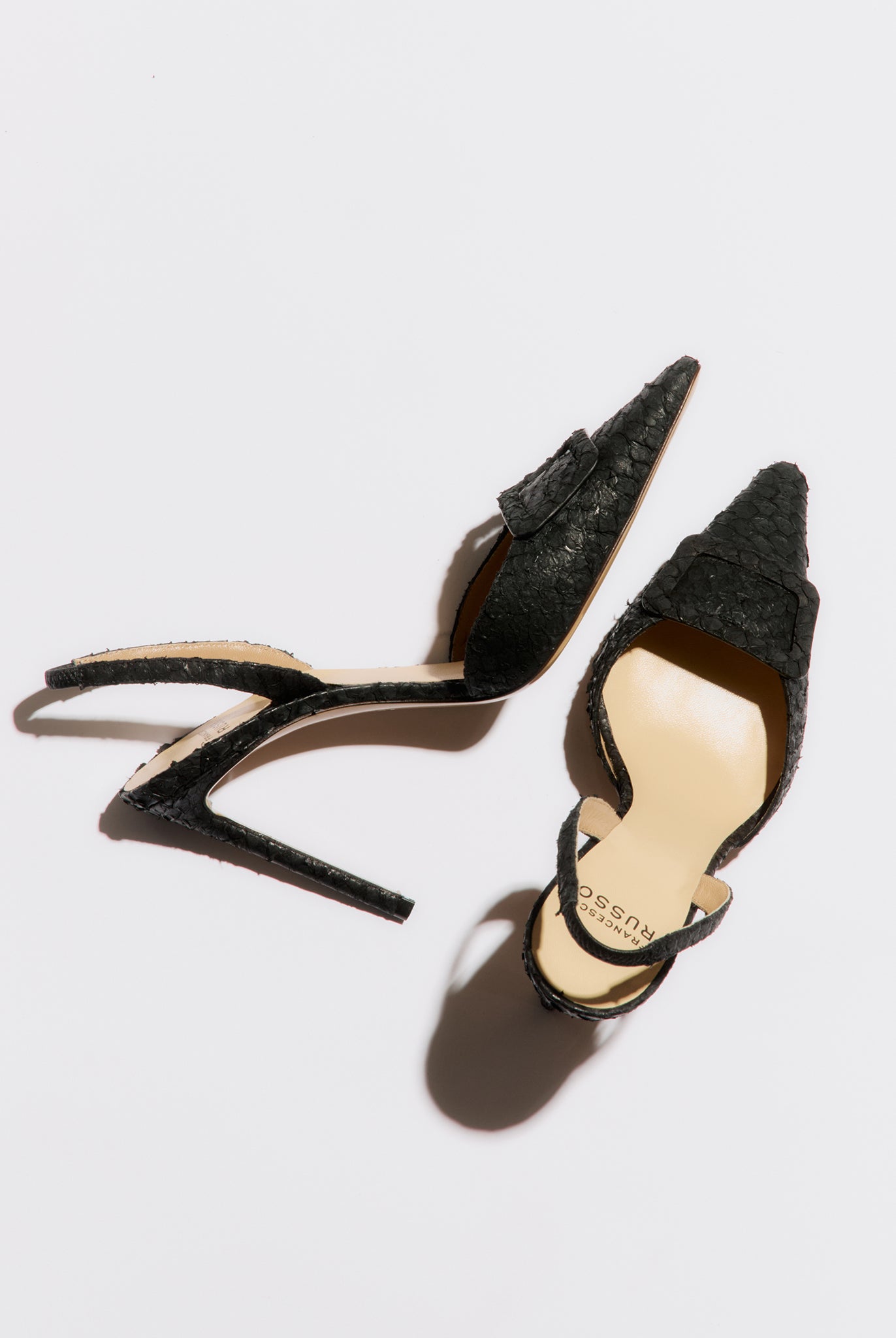 black high-heeled slingback with buckle