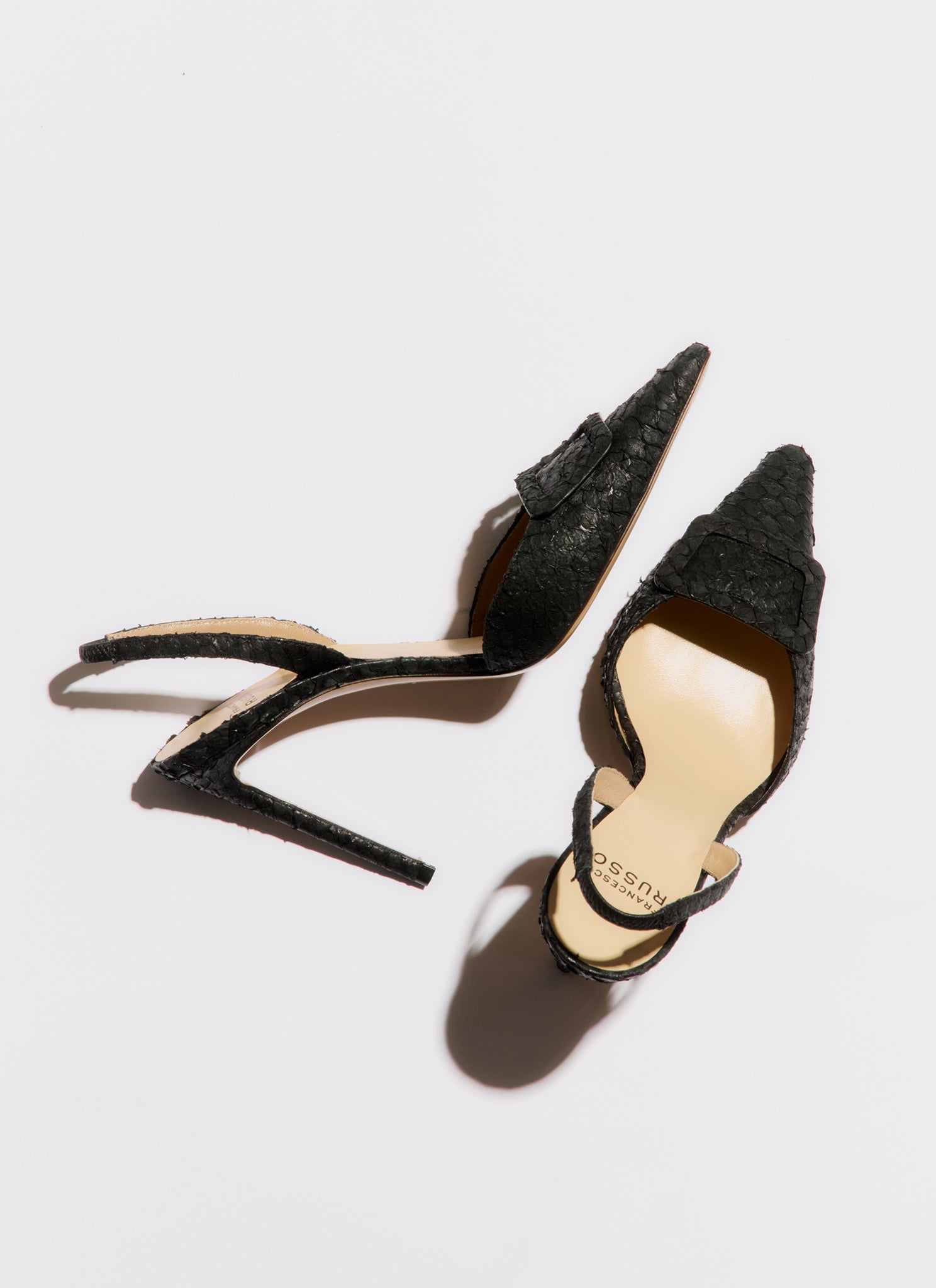 black high-heeled slingback with buckle