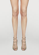 High-heeled snake print sandal on a light gray background