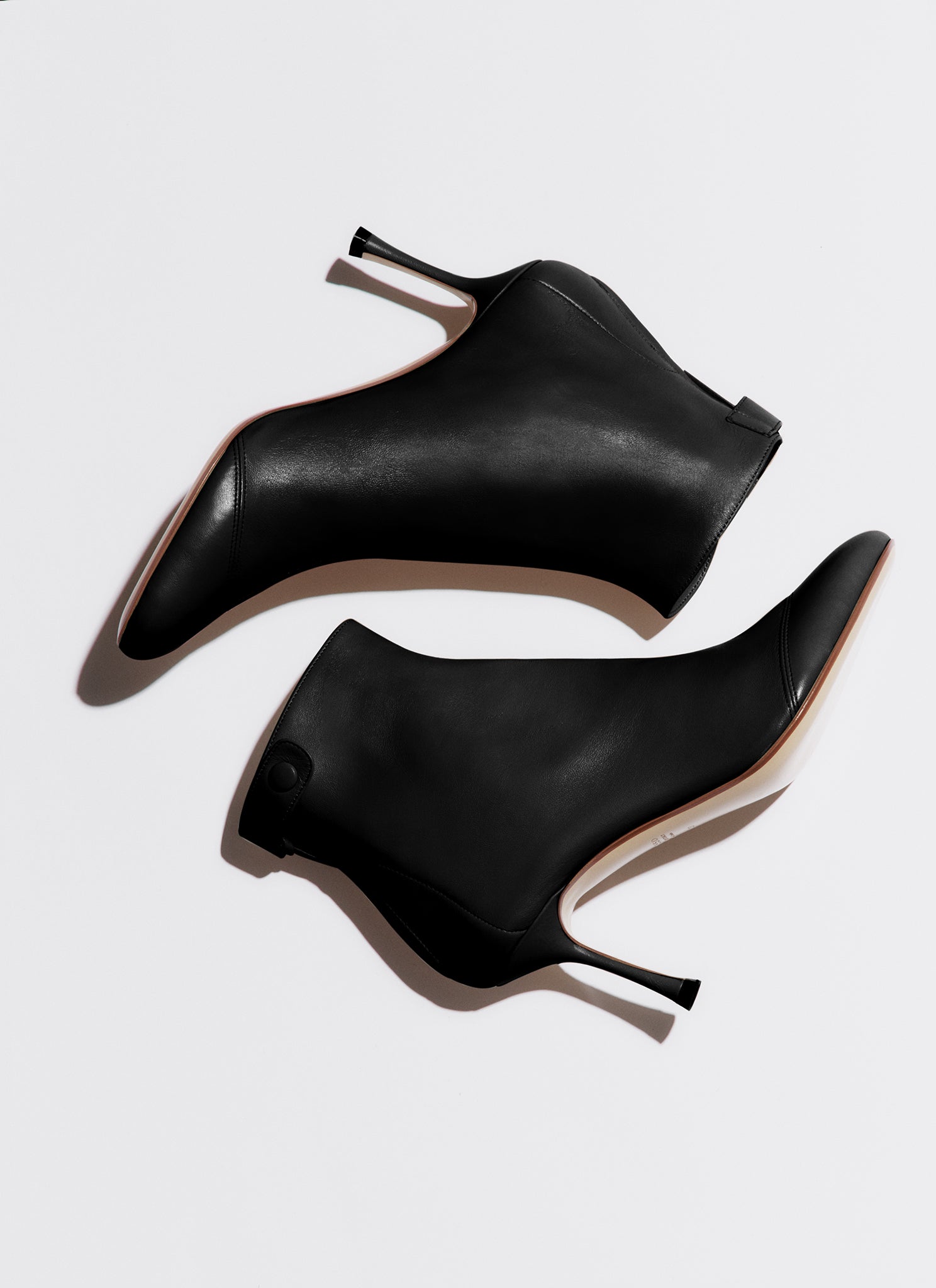 black soft bootie with a zip and button closure on the back heel hight 95mm