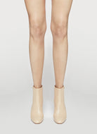 dust soft bootie with a zip and button closure on the back heel hight 95mm