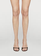 Black heeled mule in lux waternsake